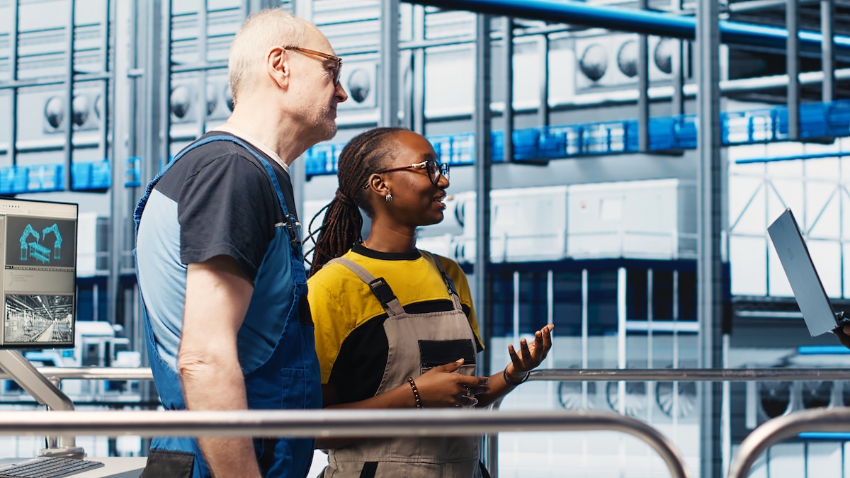 engineers talking on plant floor